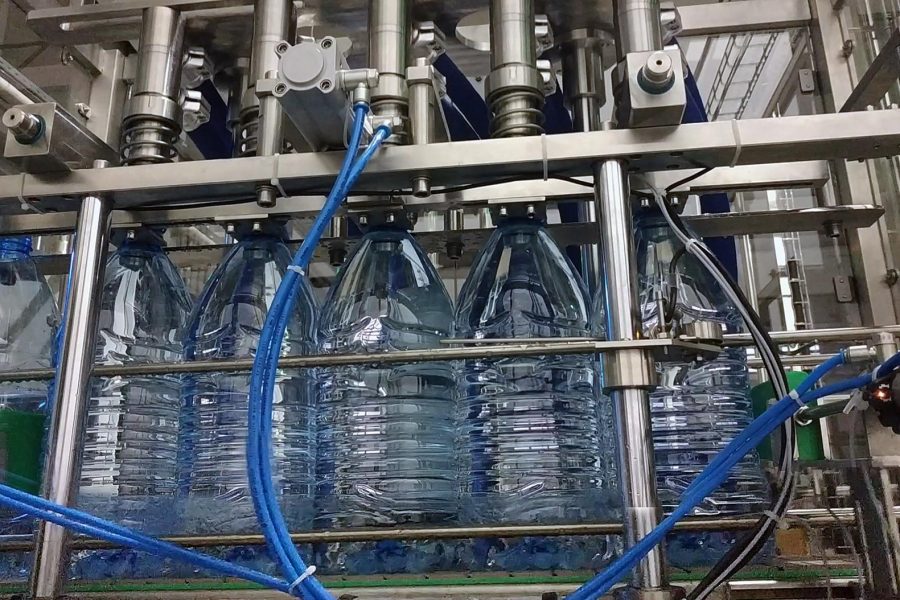 6-liter bottles on the production line, at the automatic bottle filling machine.